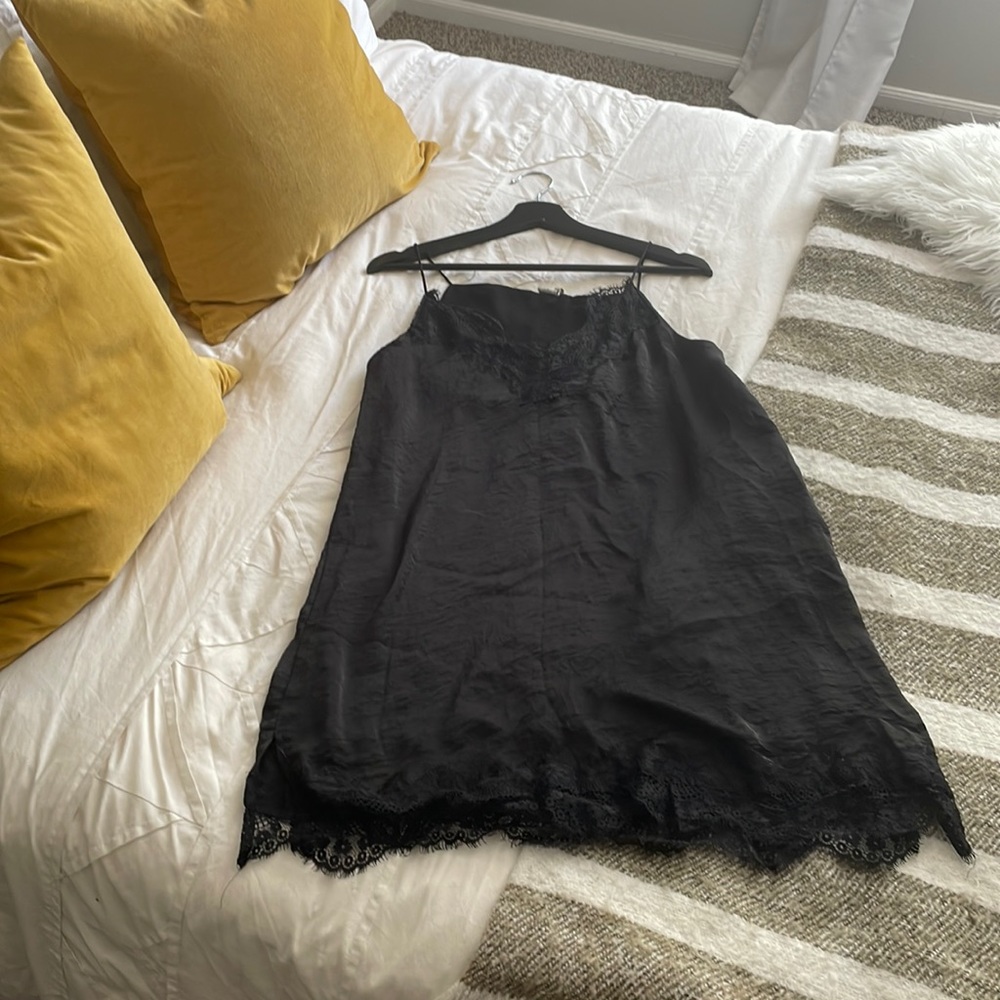 NWOT. Light-weight black dress. Has a black liner.